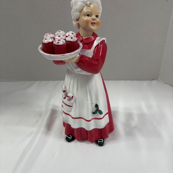Mrs Claus figurine holding a tray of red cupcakes. - Picture 4 of 7